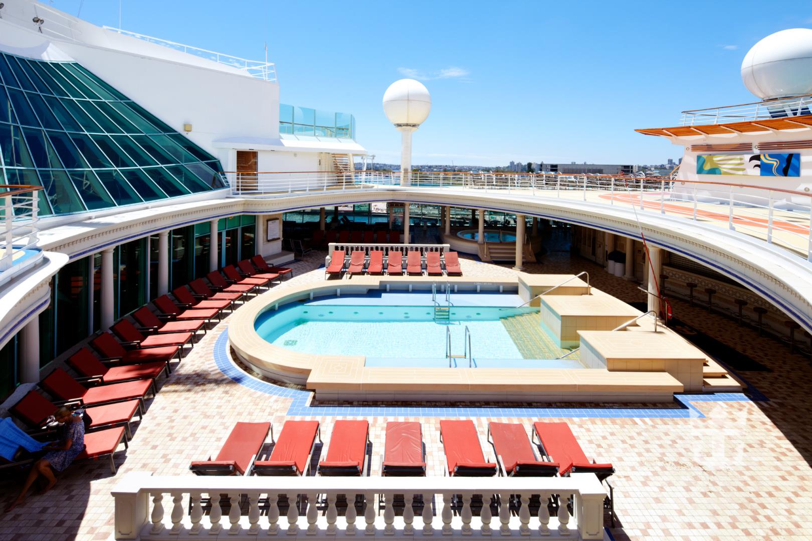 View of pool and lounge chairs on upper deck